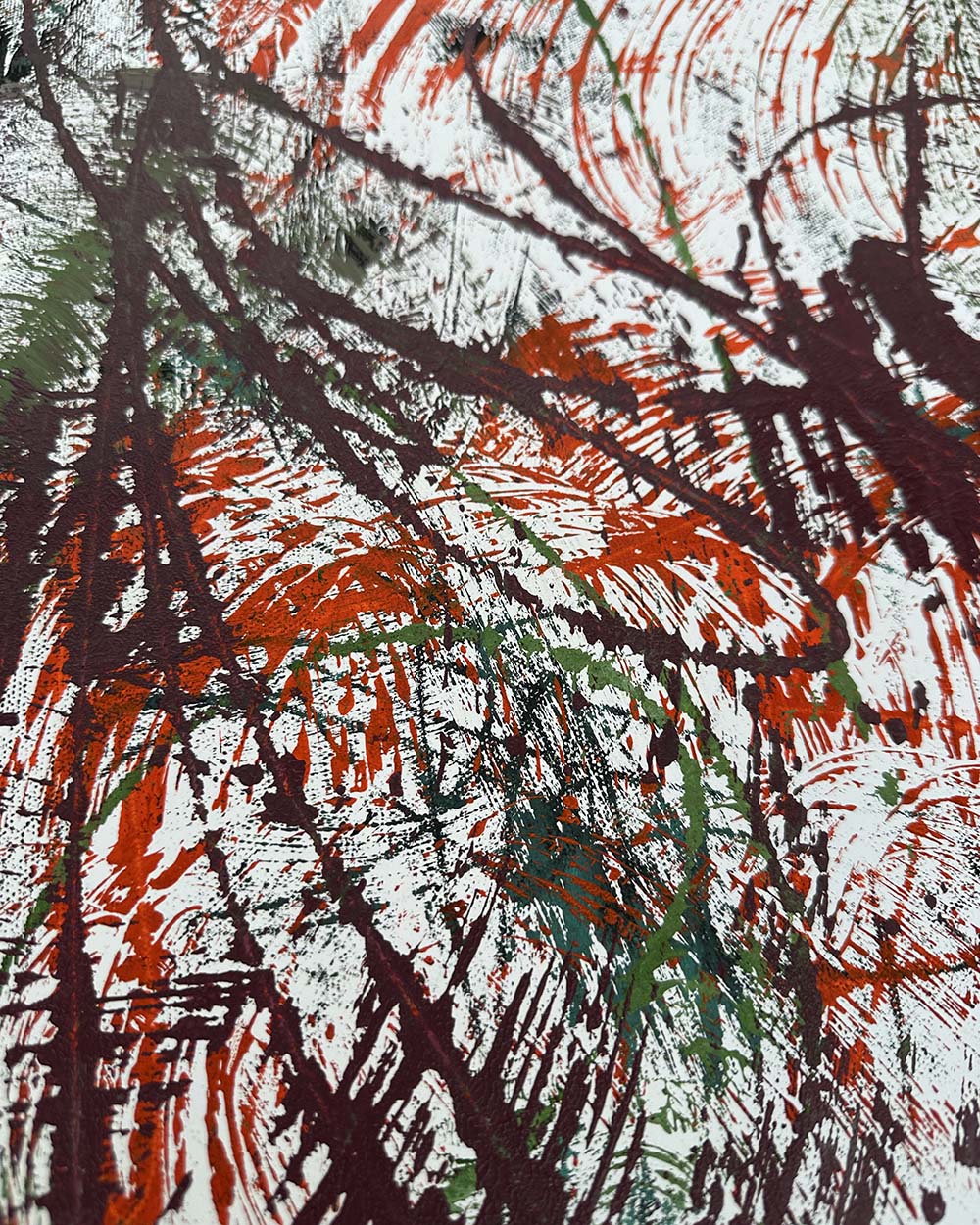 Abstract art with red, black, and green brush strokes on a white background