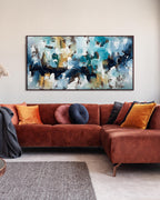large original blue abstract painting modern art landscape above curved sofa in living room.