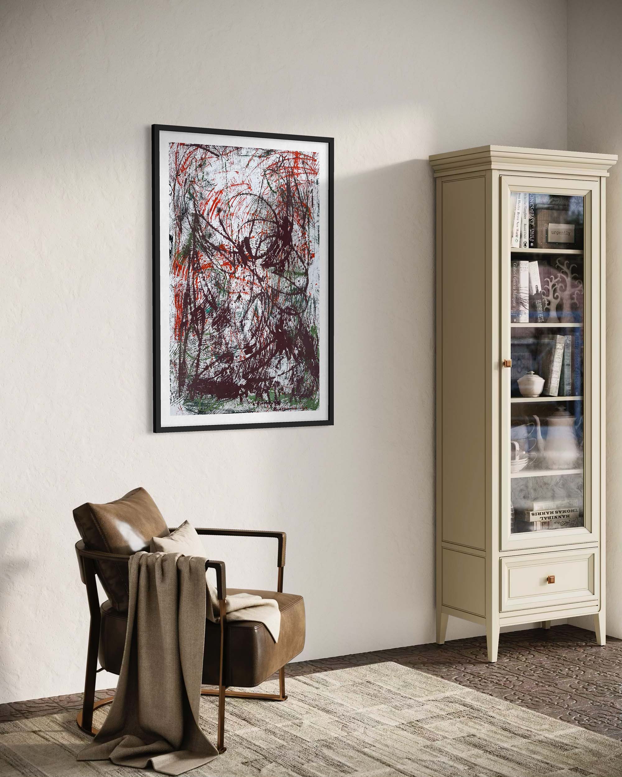 Living room with a chair, abstract painting on the wall, and a bookshelf.